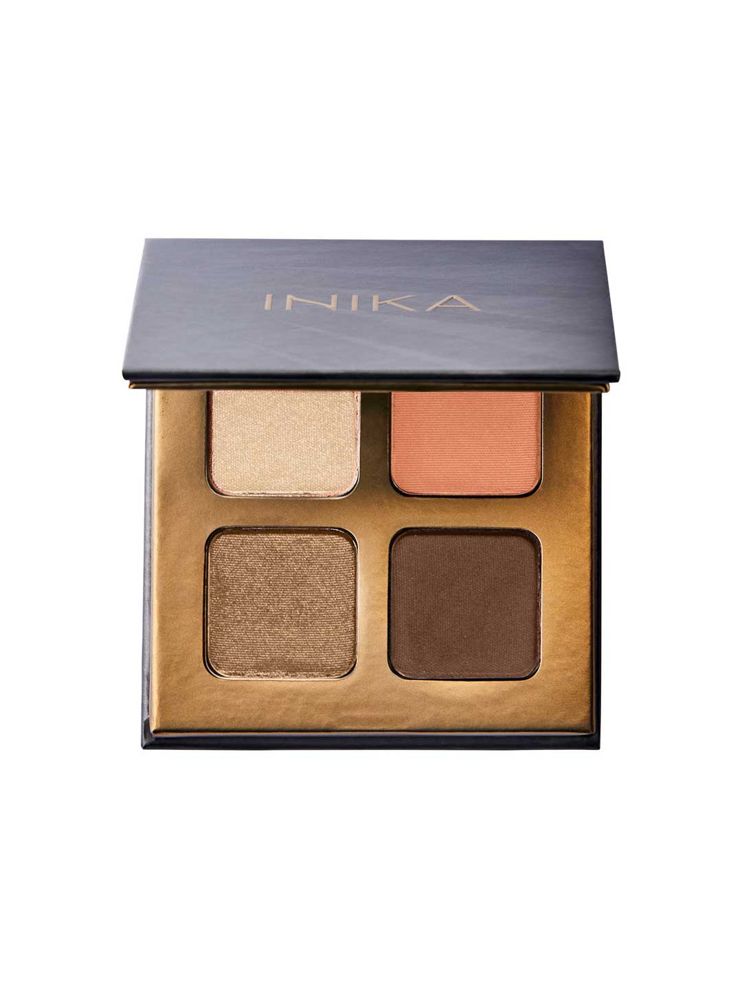 The INIKA Organic Eyeshadow Quad - Sunset 8g offers four talc-free mineral shades—light gold, peach, bronze, and dark brown—in a chic gold-trimmed case with a black lid labeled INIKA.