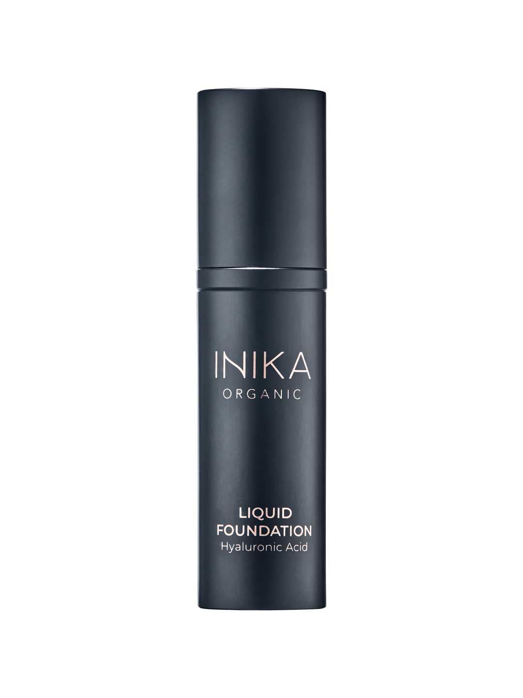 INIKA Organic Liquid Foundation 30ml comes in a sleek black bottle with white text, offering a luxurious formula enriched with hyaluronic acid for a dewy finish.