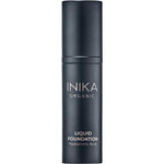 INIKA Organic Liquid Foundation 30ml comes in a sleek black bottle with white text, offering a luxurious formula enriched with hyaluronic acid for a dewy finish.