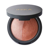 An open round compact reveals the INIKA Organic Mineral Baked Blush Duo - Pink Tickle 6.5g, featuring domed vegan blush in peach and rose shades from the Mineral Baked Blush collection.