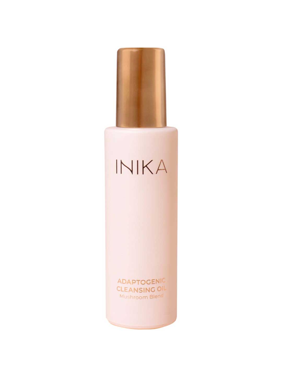 A light pink bottle with a gold cap labeled INIKA Organic Organic Adaptogenic Cleansing Oil 80ml stands upright against a white background, highlighting an organic cleansing oil perfect for adaptogenic mushroom skincare routines.