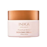 A 50ml jar of INIKA Organic Phytofuse Renew Rich Day Cream—vegan moisturiser for dry skin—with a white container, metallic rose gold lid, and product details printed on the front.