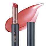 The INIKA Organic Tinted Lip Balm - Cosmic 3.5g is a rose-pink, moisturising vegan lip balm in a dark metallic tube with the cap off; "INIKA ORGANIC" appears on the label and a swipe of the color is shown in the background.