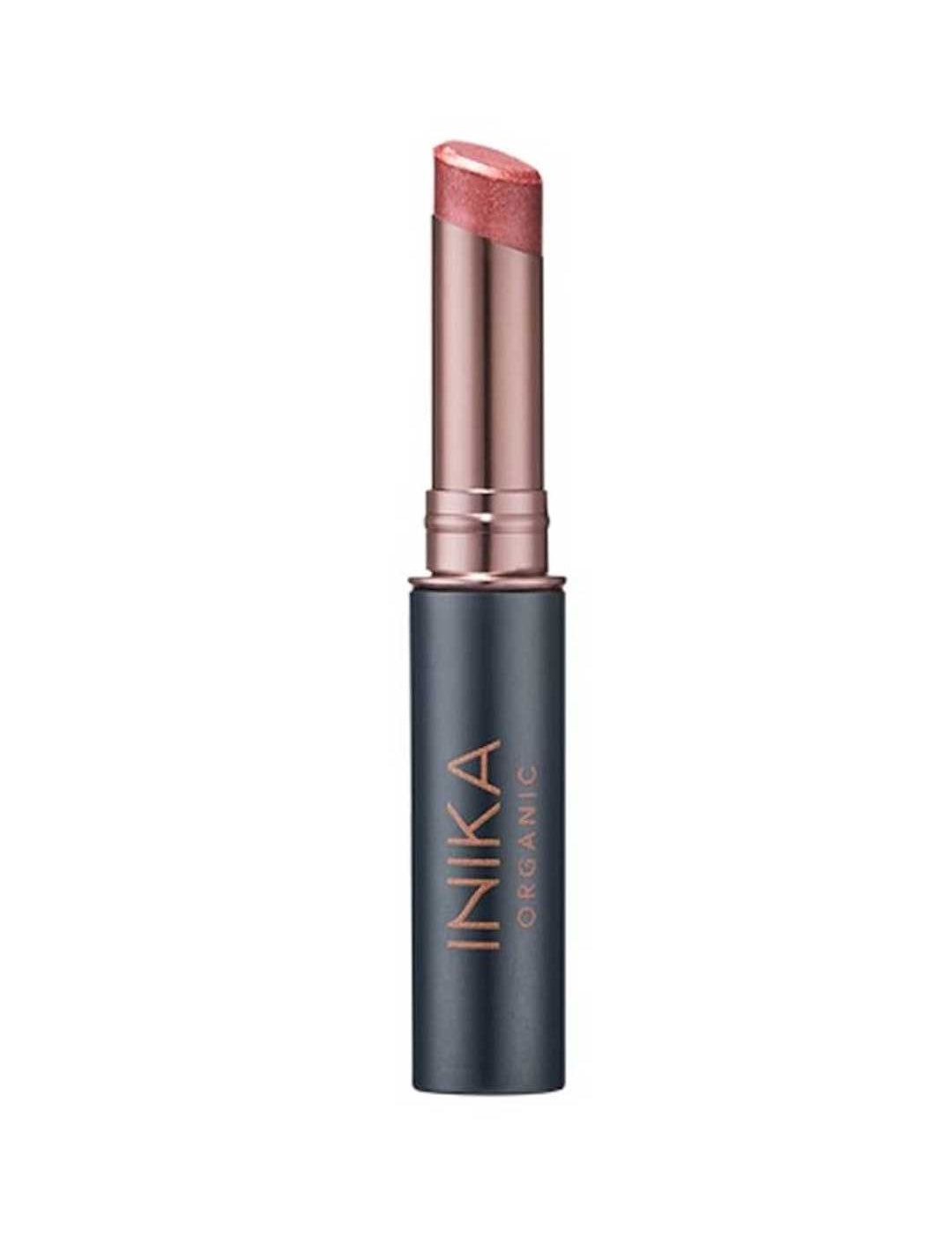 A partially opened INIKA Organic Tinted Lip Balm - Rose 3.5g in a rose gold and black tube reveals its shimmery pink tint, with the INIKA ORGANIC brand name displayed vertically on the casing.