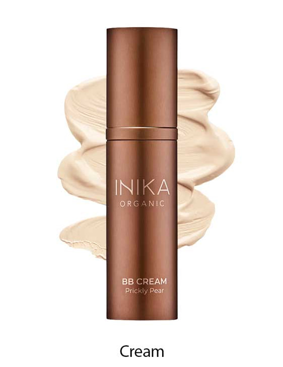 A bronze bottle labeled INIKA Organic Organic BB Cream 30ml stands before beige cream swirls on a white background, showcasing this product’s natural satin finish. The word "Cream" appears below the image.