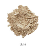 A mound of light beige powder from the INIKA Organic Foundation Trial Sets - 4 Piece Set is shown on a white background, with "Light" written below.