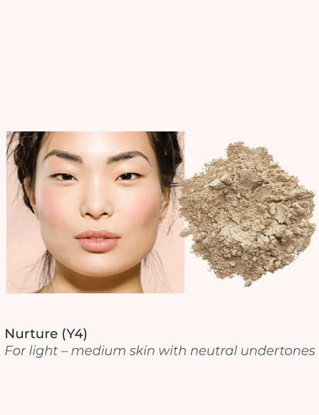 A woman with light–medium, neutral-toned skin wears a natural look next to INIKA Organic Loose Mineral Foundation SPF25 8g—ideal for light–medium skin seeking a non-comedogenic finish.