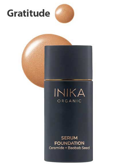 A bottle of INIKA Organic Serum Foundation 25ml is shown in the shade Gratitude, with a hydrating foundation swatch featuring Ceramide and Baobab Seed displayed above the bottle.