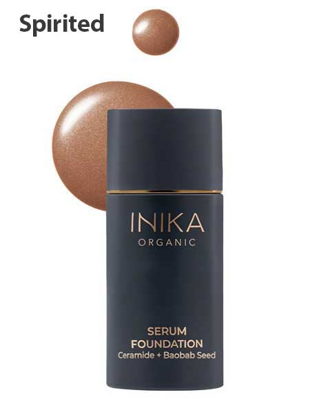 The INIKA Organic Serum Foundation 25ml, a hydrating foundation with Ceramide and Baobab Seed in the Spirited shade, is displayed with a swatch of its medium brown hue—ideal for natural, anti-ageing makeup.