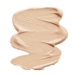 A thick, smooth smear of INIKA Organic Liquid Foundation 30ml in beige rests on a white background, its creamy, vegan texture shown by textured brush strokes. "Beige" is labeled below the swatch.