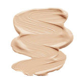 A thick, smooth smear of INIKA Organic Liquid Foundation 30ml in beige rests on a white background, its creamy, vegan texture shown by textured brush strokes. "Beige" is labeled below the swatch.