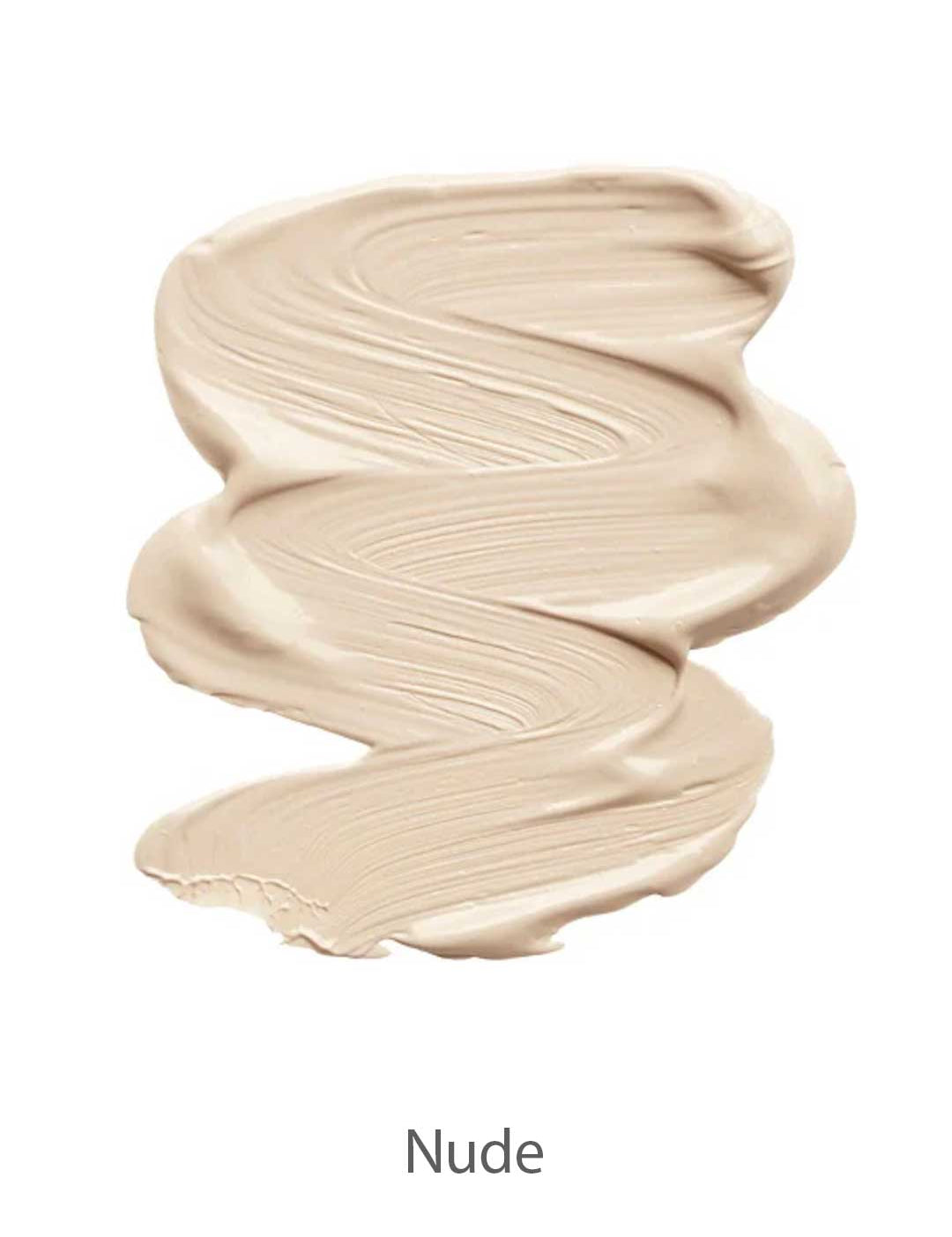 A smooth, creamy, light beige smear of INIKA Organic Liquid Foundation 30ml with visible brush strokes and labeled Nude at the bottom.