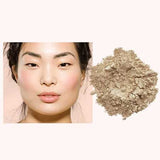 A woman with smooth, glowing skin and soft pink blush sits beside INIKA Organic Loose Mineral Foundation SPF25 8g, displayed as a loose powder on a light background.