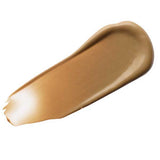 A swatch of Luk Beautifood Instant Glow Skin Tint 30ml in Nude 6: Tan, a light coverage tinted moisturiser for a radiant glow, is shown on a white background.