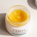 Open jar of LAMAV Intense Repair Eye Balm showing the balm