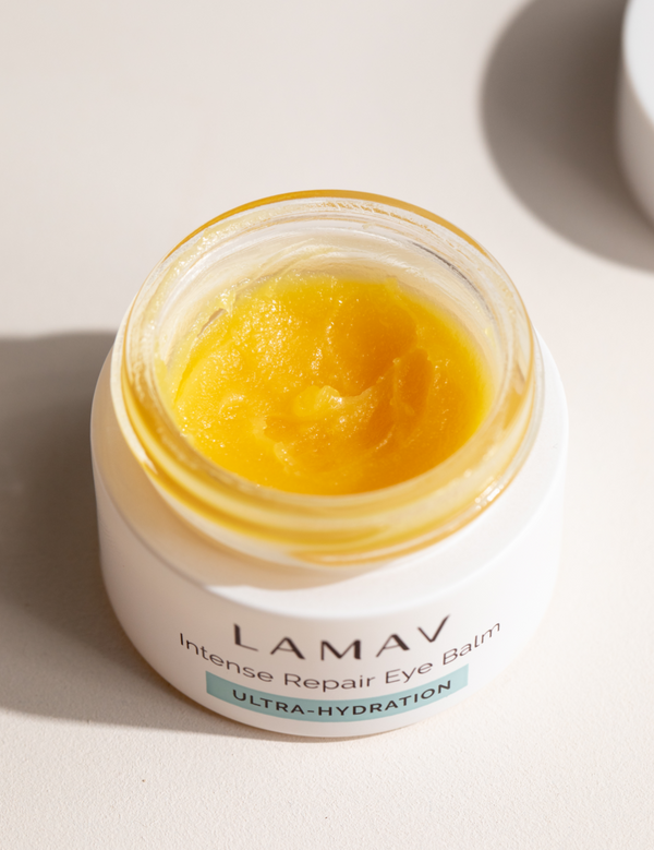 Open jar of LAMAV Intense Repair Eye Balm showing the balm