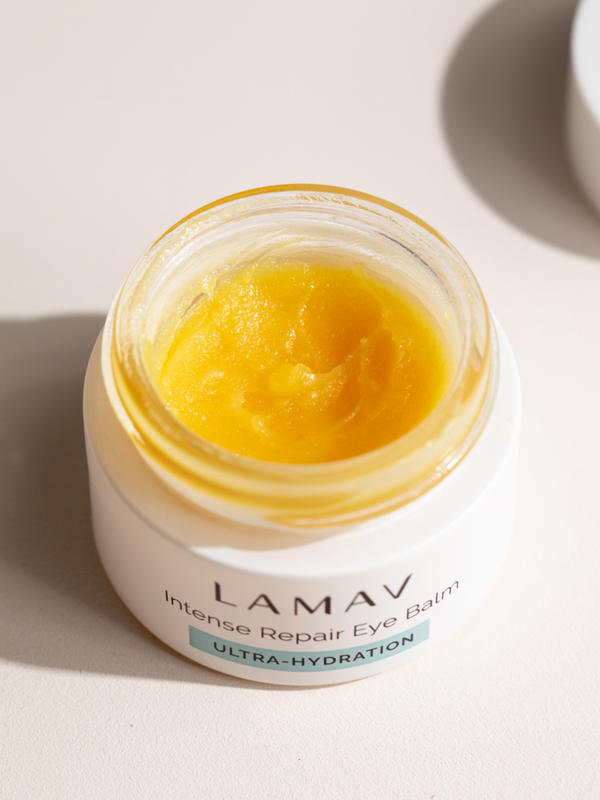 Open jar of LAMAV Intense Repair Eye Balm showing the balm