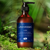 Antipodes Juliet Anti-Blemish Gel Cleanser bottle among native greenery