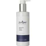 A white plastic pump bottle labeled Juniper Intensive Body Lotion 250ml for all skin types, ideal for dry mature skin, features a dark blue band near the bottom and a silver pump dispenser.