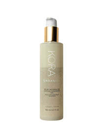A 150 ml (5 fl. oz.) bottle of Kora Organics Milky Mushroom Gentle Cleansing Oil featuring a white pump with gold accent and product details in white and black text on the label.