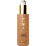 KORA Organics Noni Glow Body Oil 100ml features a gold pump and white cap, delivering nourishing organic oil for radiant, hydrated skin.