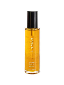 A clear bottle of LAMAV Ayurvedic Body Oil Nourish 120ml with a black cap, containing golden organic oil. The label reads LAMAV Ayurvedic Body Oil NOURISH and shows a volume of 120ml (4.06 fl oz).