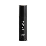 A black bottle of LAMAV Anti-Ageing Face Tan Serum 50ml, featuring hyaluronic acid, is displayed upright on a white background. This organic serum hydrates and nourishes while providing a natural-looking glow.