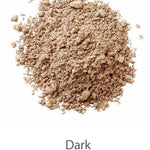 A mound of light brown powder labeled Dark on a white background, LAMAV’s Anti Ageing Mineral Foundation SPF 15 delivers flawless coverage.