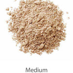 A mound of finely ground, light brown LAMAV Anti Ageing Mineral Foundation SPF 15 sits on a white background. The word "Medium" is below the image, indicating the product’s texture or grind size.