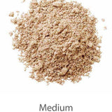 A loose pile of LAMAV Anti Ageing Mineral Foundation SPF 15 (8g) in light brown is displayed against a white background. The word "Medium" appears below, indicating the shade of this mineral foundation.