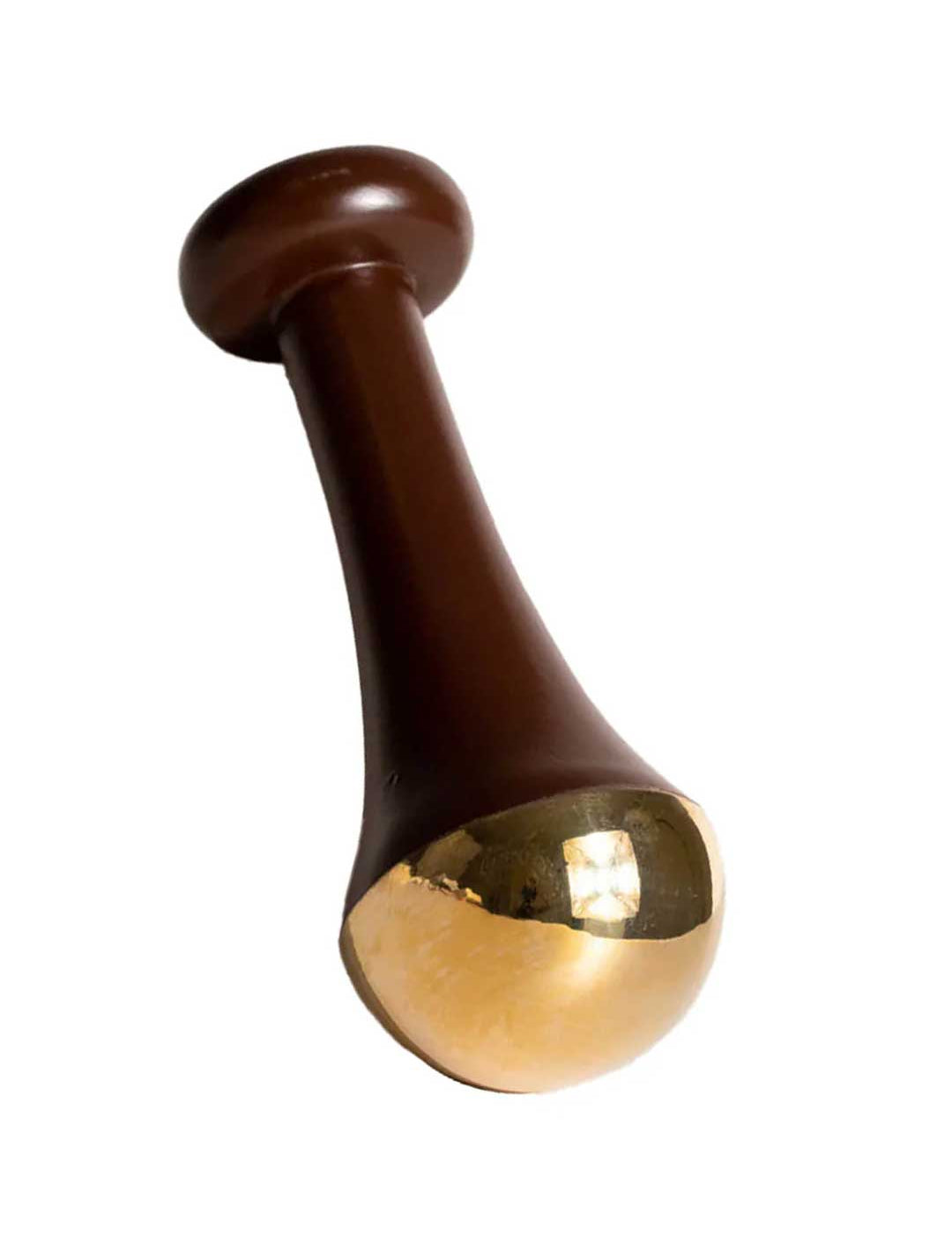 The LAMAV Ayurvedic Kansa Wand features a brown handle with a flared design and a rounded, shiny gold-colored tip, ideal for facial massage to support lymphatic drainage and promote radiant, healthy skin.