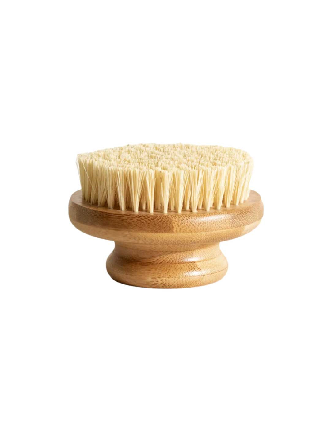 The LAMAV Garshana Dry Body Brush features a round wooden design, short handle, and dense light bristles—perfect for exfoliation and lymphatic drainage—displayed against a white background. Brand: LAMAV.