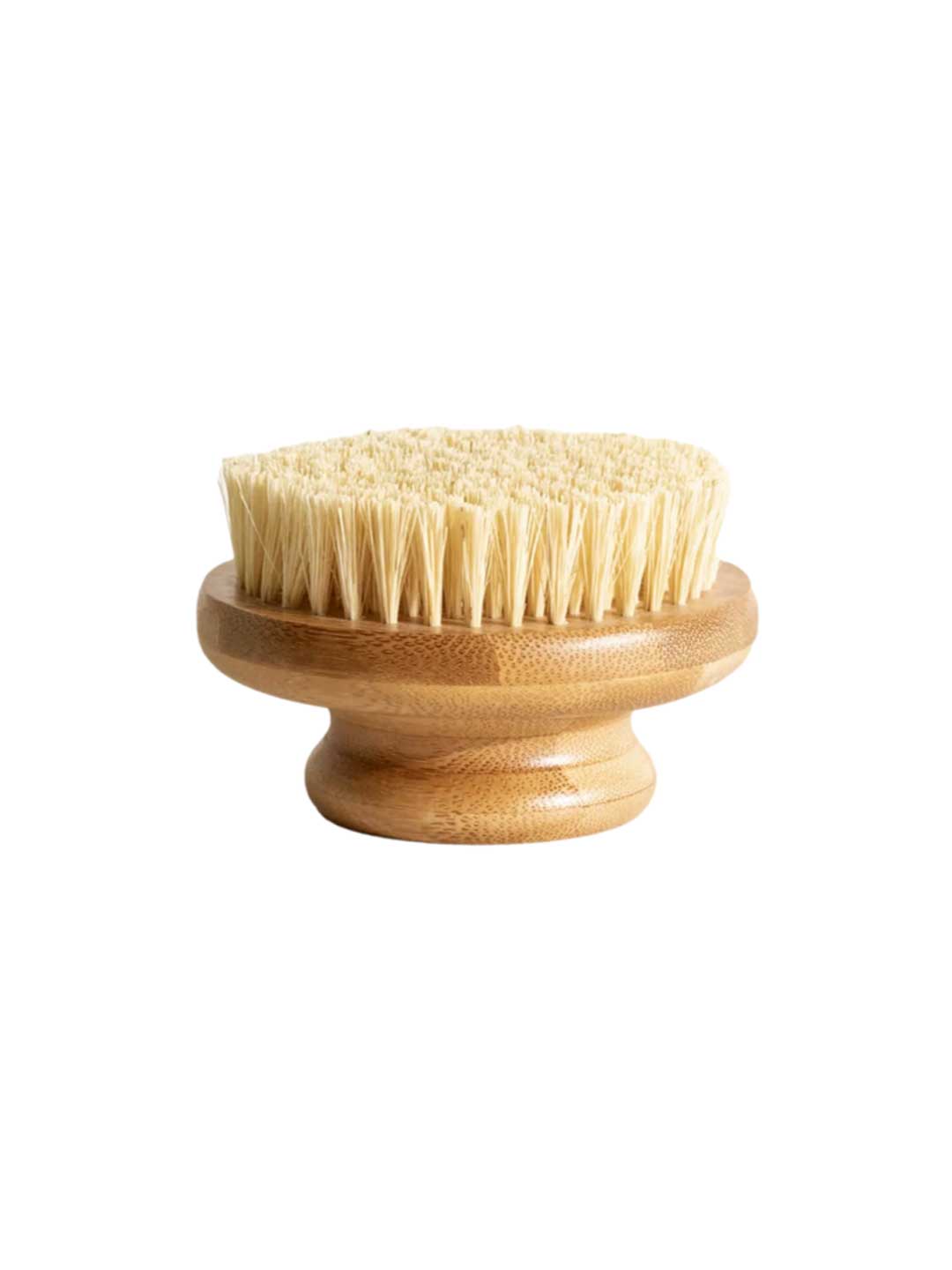 The LAMAV Garshana Dry Body Brush features a round wooden design, short handle, and dense light bristles—perfect for exfoliation and lymphatic drainage—displayed against a white background. Brand: LAMAV.