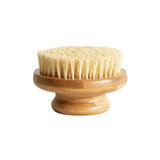 The LAMAV Garshana Dry Body Brush features a round wooden design, short handle, and dense light bristles—perfect for exfoliation and lymphatic drainage—displayed against a white background. Brand: LAMAV.