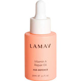 A peach-colored bottle of LAMAV Vitamin A Repair Oil 30ml with bakuchiol and a white dropper cap. The label highlights it as an anti-ageing facial oil that offers age-defence benefits.