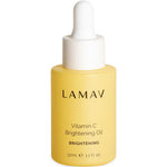 A 30ml yellow bottle of LAMAV Vitamin C Brightening Oil with a white dropper cap. This organic face oil by LAMAV is formulated to brighten skin, as indicated on the label (1.1 fl oz).