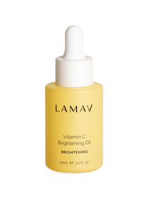 A 30ml yellow bottle of LAMAV Vitamin C Brightening Oil with a white dropper cap. This organic face oil by LAMAV is formulated to brighten skin, as indicated on the label (1.1 fl oz).