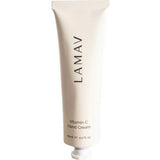 A beige tube of LAMAV Vitamin-C Hand Cream 60ml stands upright, featuring the product name printed vertically on the front.