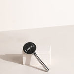 LAMAV Tube Key on a skincare tube