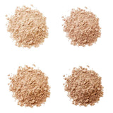 Four small piles of light brown LAMAV Anti Ageing Mineral Foundation SPF 15 arranged in a square on a white background, highlighting the smooth texture of this mineral powder by LAMAV.