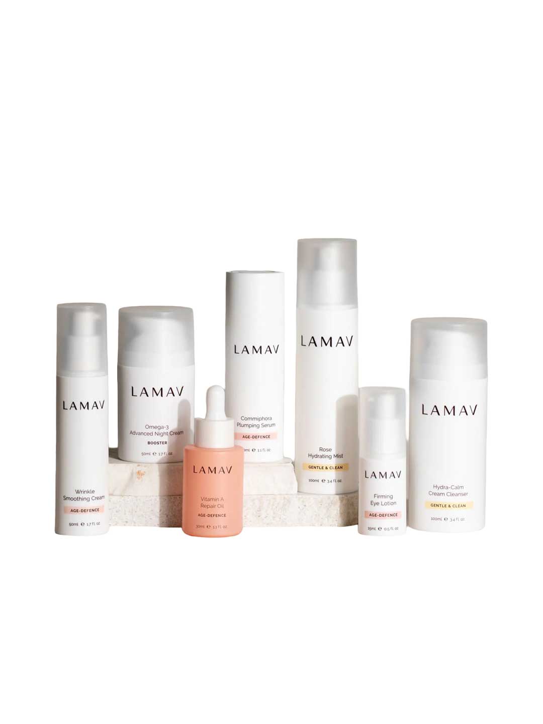 The LAMAV Age-Defence Complete Skincare Collection for Dry/Sensitive Skin (7 pack) features seven LAMAV products in white and pink bottles, arranged on a white background—ideal for age-defence routines and sensitive skin care.