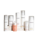 The LAMAV Age-Defence Complete Skincare Collection for Dry/Sensitive Skin (7 pack) features seven LAMAV products in white and pink bottles, arranged on a white background—ideal for age-defence routines and sensitive skin care.