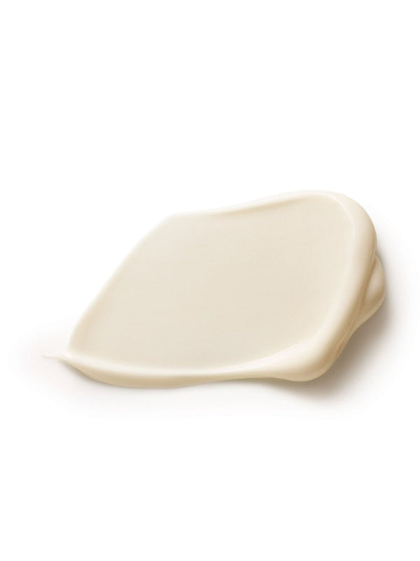 Close-up of a smooth ivory Dr Hauschka Lavender Sandalwood Body Cream smear with a raised folded edge and a soft sheen on white.