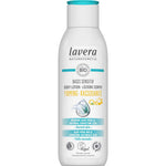 A white bottle of Lavera Basis Sensitiv Body Lotion Firming Q10 250ml for normal skin, with a blue cap and labels featuring organic aloe vera, Q10 for firming, and vegan, natural ingredients.