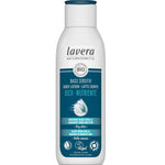 A white 250ml bottle of Lavera Basis Sensitiv Body Lotion Rich for sensitive skin, with organic aloe vera and shea butter. The blue and white label shows product info plus Vegan and Climate Neutral certification logos.
