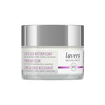A white and silver jar of Lavera Firming Day Cream 50ml with natural hyaluronic acid and bakuchiol, multilingual text, and a BIO label on the front.