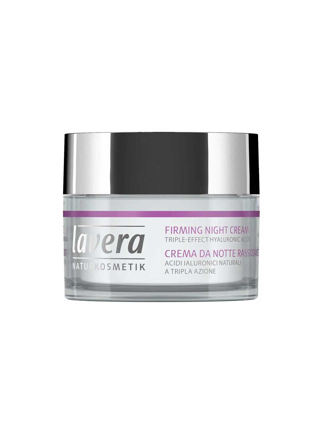 A clear and silver jar of Lavera Firming Night Cream 50ml with triple-effect hyaluronic acid. The label, in English and Italian with a purple accent, highlights its anti-aging night cream benefits.