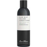 A 200ml bottle of Less is More Aloe Mint Volume Conditioner, featuring a black base and white label with black text; an organic solution designed to give fine hair a fuller appearance.