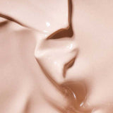 Close-up of a smooth, creamy beige liquid with subtle swirls and texture, labeled Colour: Light—perfect for highlighting the Hyaluronic Anti-Pollution CC Cream SPF15 40ml in your skincare routine.