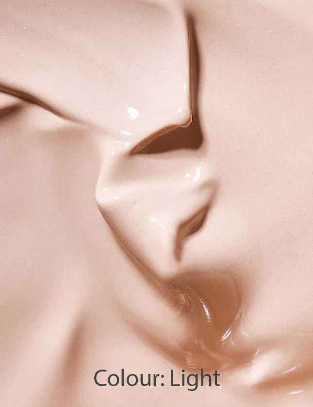 Close-up of a smooth, creamy beige liquid with subtle swirls and texture, labeled Colour: Light—perfect for highlighting the Hyaluronic Anti-Pollution CC Cream SPF15 40ml in your skincare routine.